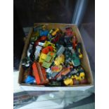 A box of playworn die cast trucks, cars