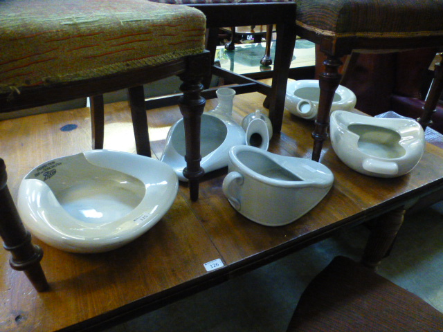 A collection of six ceramic bed pans