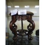 An eastern carved wooden stand