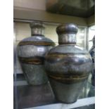 Two reproduction eastern metalware urns