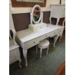 A modern cream painted dressing table wi