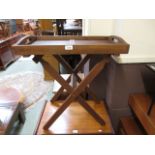 A teak butlers tray on stand