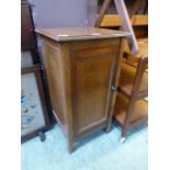 An early 20th century oak pot cupboard