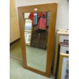 A modern oak framed rectangular mirror