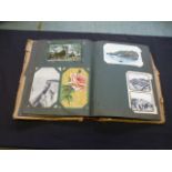 A postcard album with a collection of ea