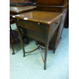 A reproduction mahogany work table, the