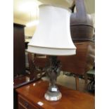 A gilt metal and marble based table lamp