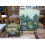 A hand painted fire screen with cottage