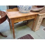 A waxed pine wash stand with two drawers