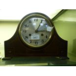A mahogany inlaid mantle clock