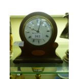 A mahogany inlaid mantle clock