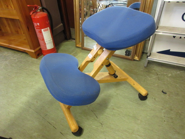 A modern beech and blue upholstered stoo