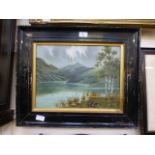 A framed oil on canvas of mountainous la