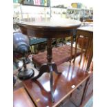 A reproduction mahogany wine table