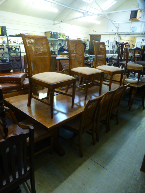 A substantial chestnut dining table toge