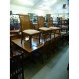 A substantial chestnut dining table toge