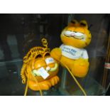 A Garfield telephone together with a Gar