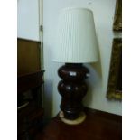 A turned and carved wooden table lamp