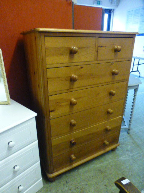 A modern pine chest of two short over fi