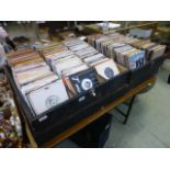 A large collection of 45 rpm records in