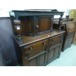 A reproduction oak court cupboard