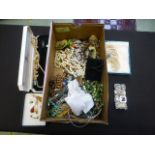 A box of costume jewellery to include ne