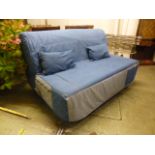 A denim upholstered sofa bed