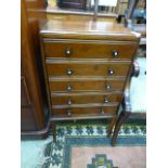 An Edwardian walnut five drawer music ca