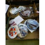 Two trays of collector's wall plates