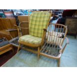 A light Ercol settee A/F together with a