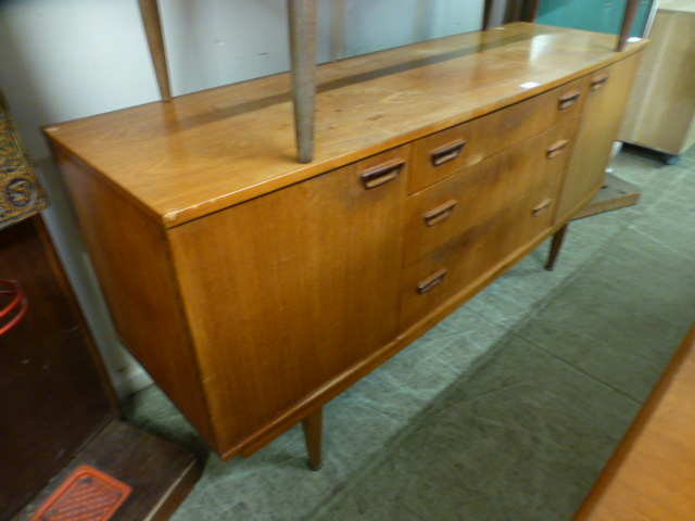 A mid-20th century teak sideboard with t