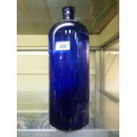 A blue glass chemist's bottle