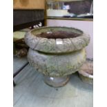 A substantial composite stone planter on