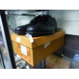 A pair of black leather men's shoes size