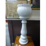 A white ceramic jardiniere