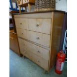 A mid 20th century chest of drawers havi