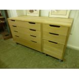 Two oak four drawer chests on castors