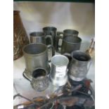 A selection of pewter tankards