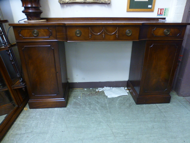 A reproduction mahogany twin pedestal sideboard