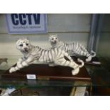 Two moulded models of tigers