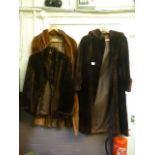 Two brown fur coats along with a fur jac