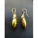 A pair of yellow metal earrings