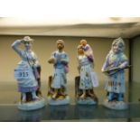 Four continental figurines