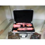 A cased pink clarinet
