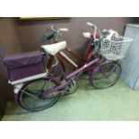 A purple ladies bike