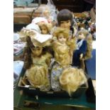 A tray of collector's dolls