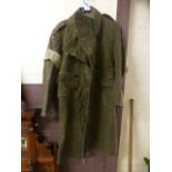 A green military great coat dated 1951