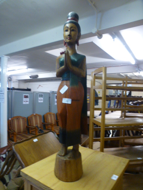 A carved wooden model of lady