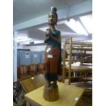 A carved wooden model of lady