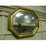 An ornate gilt framed octagonal mirror